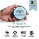 Hand holding a container of textured cream with GQ 2024 Absolute Best Hair Products for Men badge and product features listed.