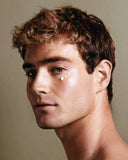 Close-up of a person with a neutral background