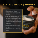 Person holding a jar of pomade with application instructions on a dark background
